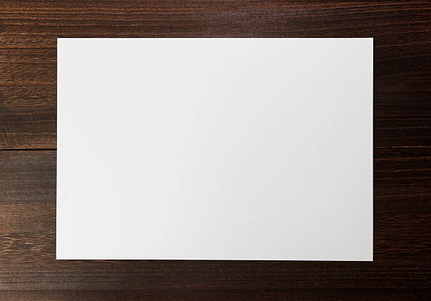 istock Blank paper on wooden background. 2207280399