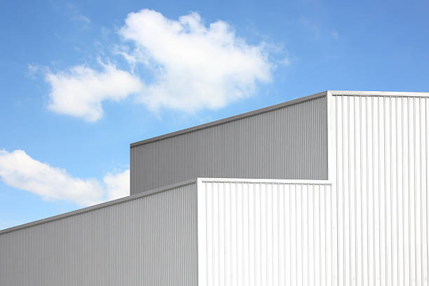 istock silver corrugated metal box square shape perspective view. geometric design corrugated texture line pattern abstract background against blue sky white cloud 2207280662