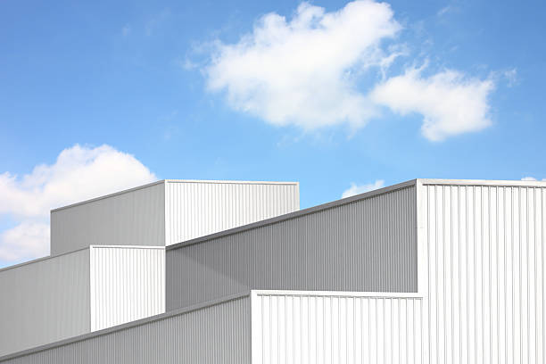 istock silver corrugated metal box square shape perspective view. geometric design corrugated texture line pattern abstract background against blue sky white cloud 2207280687