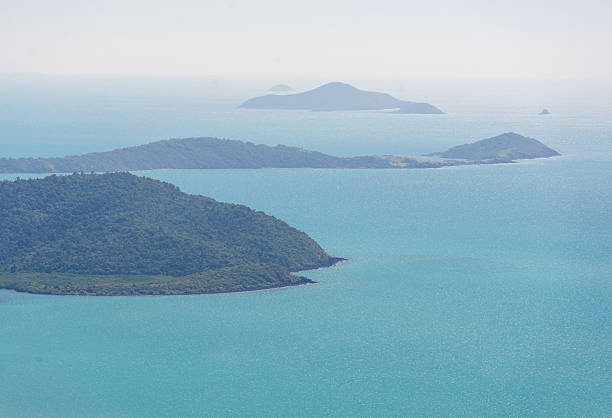 A perfect sunny day in Airlie Beach, Queensland, with clear blue skies, sparkling turquoise waters, and a warm, tropical breeze, ideal for enjoying the beach, exploring the Whitsundays, or relaxing under the sun.