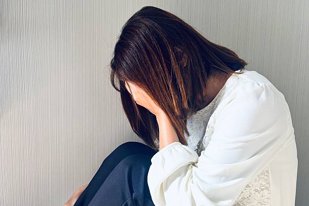 istock Woman covering her face 2207293063