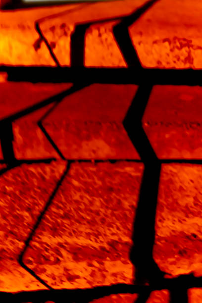 Close-up of several concrete steps illuminated by red night light. Blurred scary background. Soft focus, selective focus
