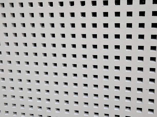 perforated plasterboard ceiling panels shatter echo in a large hall with tiled floor. entrance hall in a hotel where sounds must be muffled, press, surround sound, wooden floor