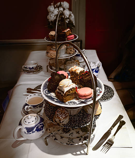 istock View of table with pastries for high tea in dimly lit room 2207296142