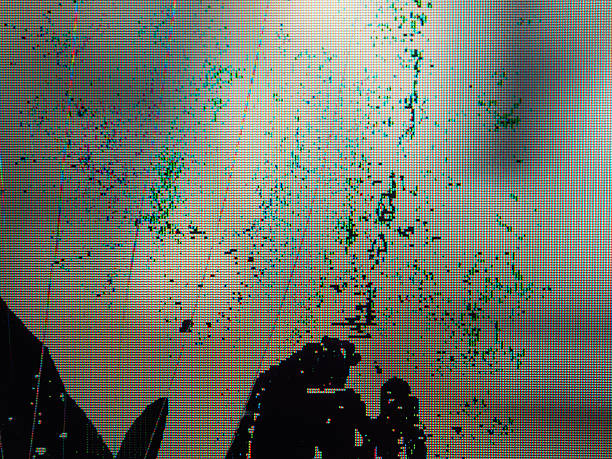istock Close-up of broken LCD LED screen showing pixel distortion and texture, creating a digital drama effect. 2207297079
