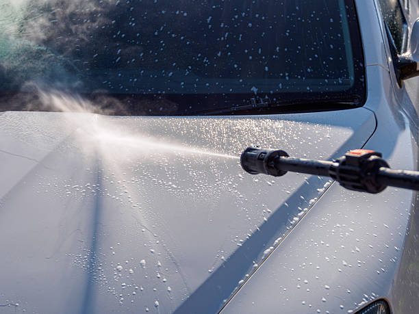 istock Manual car high-pressure wash using equipment for effective dirt removal and coating protection. 2207297201