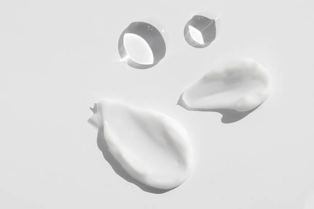 istock Drop of transparent body serum, gel and moisturizer samples top view. Liquid cosmetic texture macro. 2207297611
