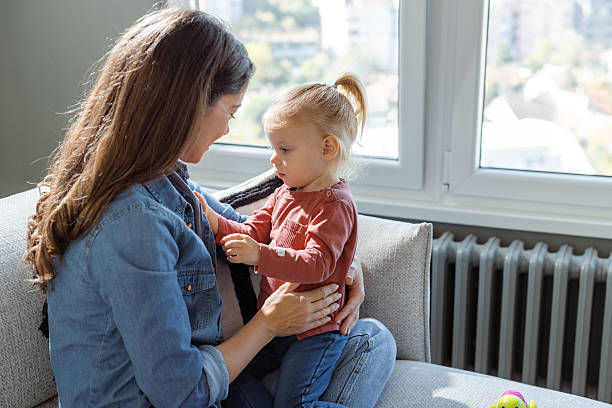 istock Mother bonding with her child in a cozy home environment 2207301984
