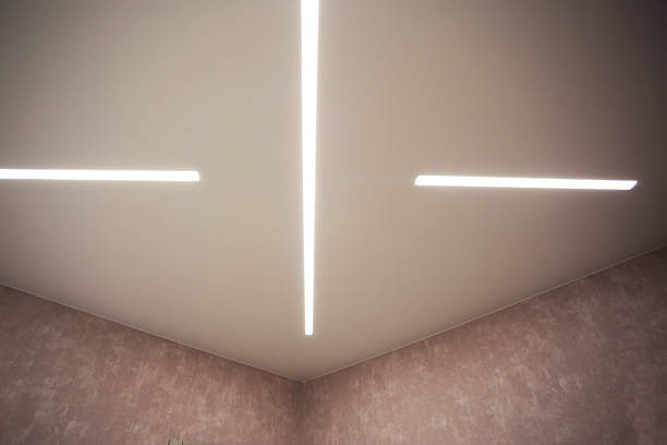 istock Modern designer stretch ceiling with illuminated LED lines in the room, backlighting 2207302793