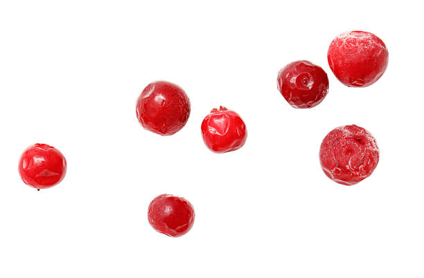 istock A bunch of red berries are scattered across a white background 2207306137