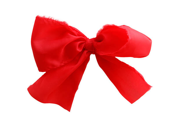Close-up of a decorative bow made of red and white gingham patterned ribbon, tied in a simple cross shape. Perfect for Christmas, rustic gift wrapping, festive packaging, craft projects, and seasonal decoration concepts.