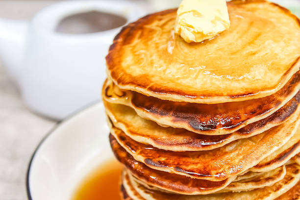 istock close up of stack of pancakes with syrup 2207309641