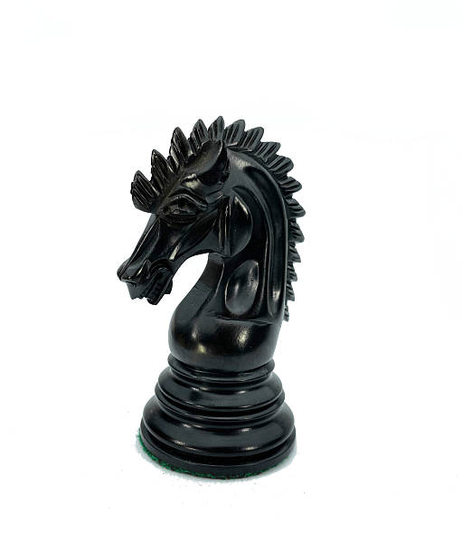 istock Close-up of a Handcrafted Black Knight Chess Piece 2207312229