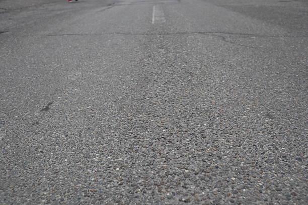 Asphalt road with white stripes on both sides