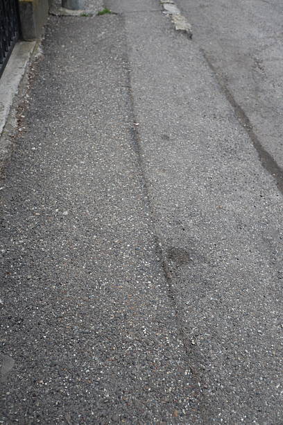 istock Degraded public road accession way 2207316530