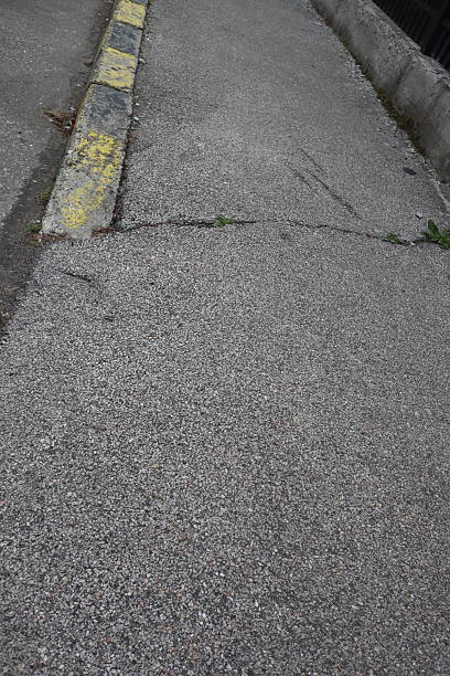istock Degraded public road accession way 2207317433