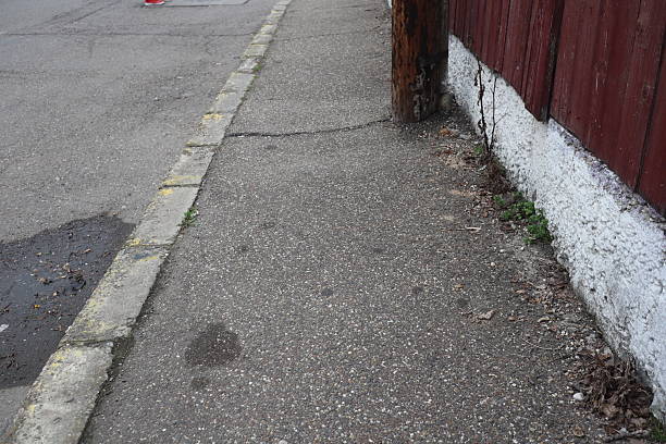 istock Degraded public road accession way 2207317528
