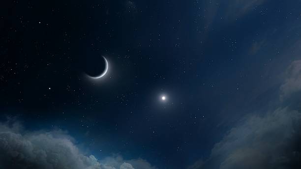 istock New Moon near planet Jupiter in night sky isolated. 2207317783