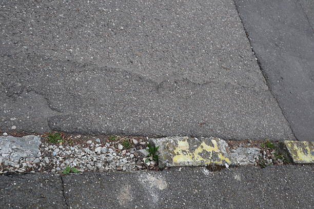 istock Degraded public road accession way 2207317797