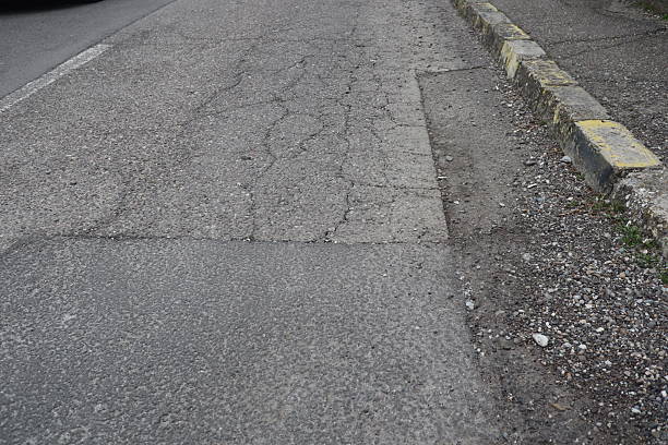 istock Degraded public road accession way 2207317923