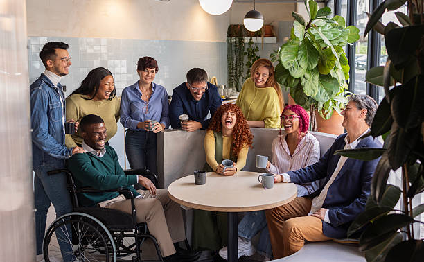 istock Diverse business team enjoying coffee break in modern office 2207318021