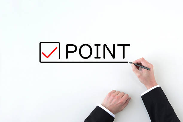Hand of a businessman drawing check marks and point words