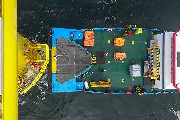 istock Transfer vessel pushing on landing ladder on large vessel, offshore platform and preparing for people and cargo transport. 2207332222