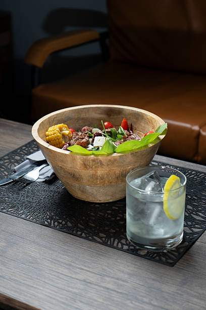 istock Salad with meat and tomatoes in a bowl on a table at the restaurant 2207332276