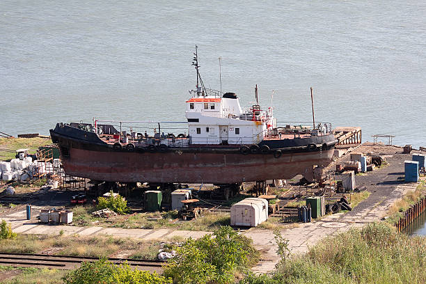 istock Fishing ship during repair work on the shore 2207335956