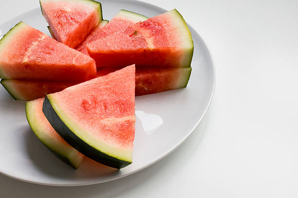 istock Freshly sliced watermelon on white plate 2207341308