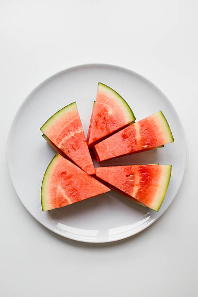 istock Juicy watermelon slices arranged on white plate 2207341347