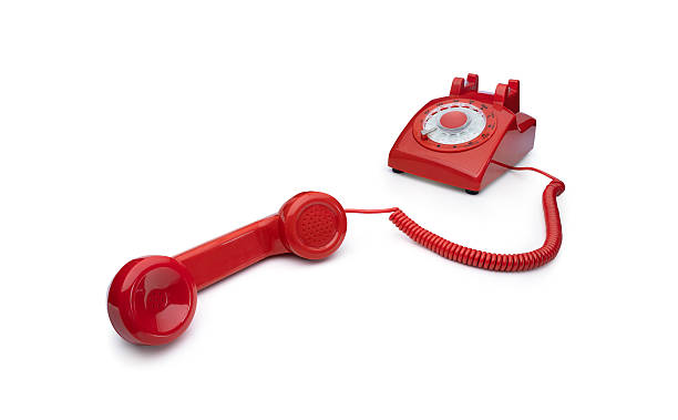 istock Old rotary telephone off the hook isolated on white background 2207342395