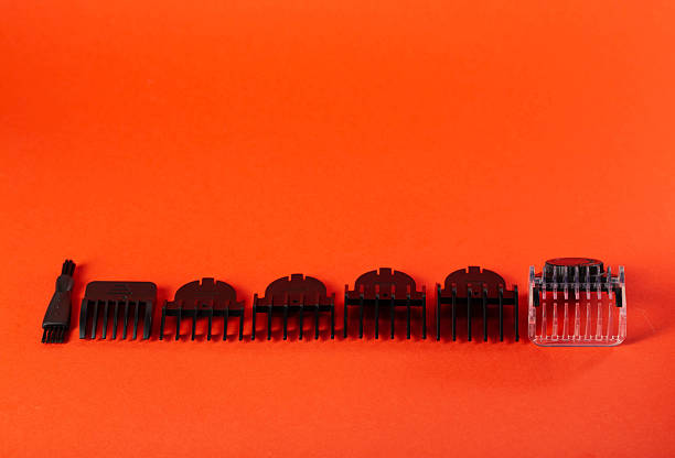 istock Set of edging attachments for trimmer on a red background, close-up. Copy space for text 2207342515