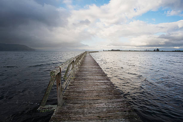 Photo of a boardwalk in a lake in New Zealand South Island.