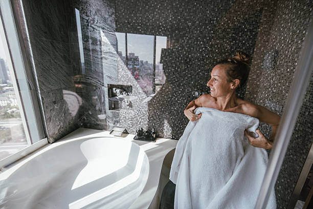 istock Woman Drying Off in a Luxurious Bathroom. 2207344155