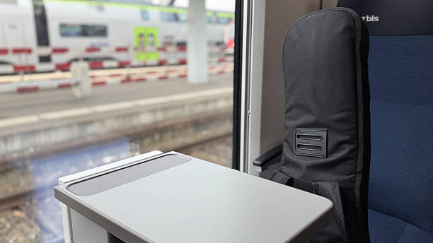 istock Empty Train Seat with a Table and View of the Platform 2207345631