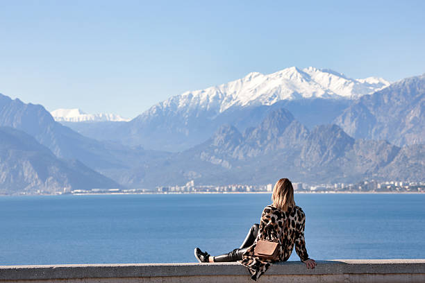 istock Woman Overlooking Antalya Harbor and Mountains 2207345763