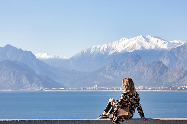 istock Woman Overlooking Antalya Harbor and Mountains 2207345849