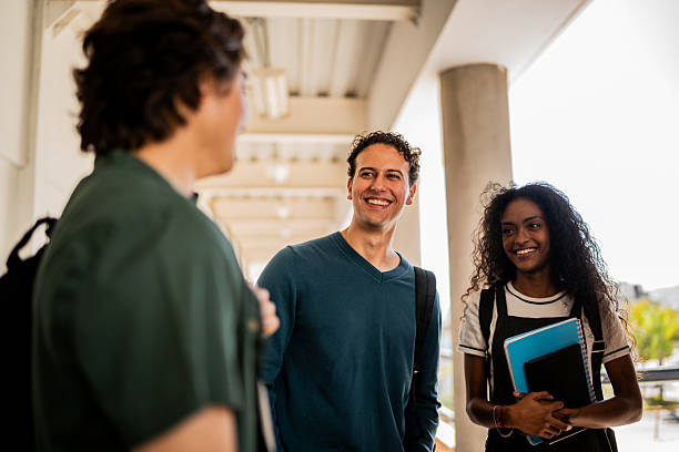 istock Young student friends talking at university 2207347870