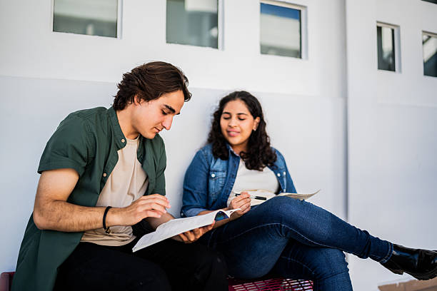 istock Young student friends talking and studying at university 2207348301