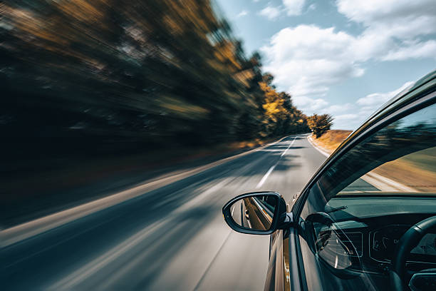 istock A car is driving on the highway, the environment is blurred 2207350897