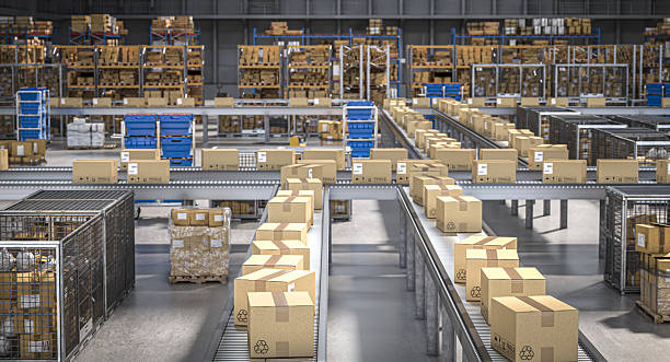 istock Cardboard boxes moving on conveyor belts in distribution warehouse 2207351806