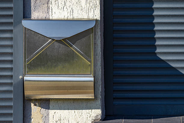 istock Metal, silver mailbox hanging on the wall, company in liquidation, 2207352540