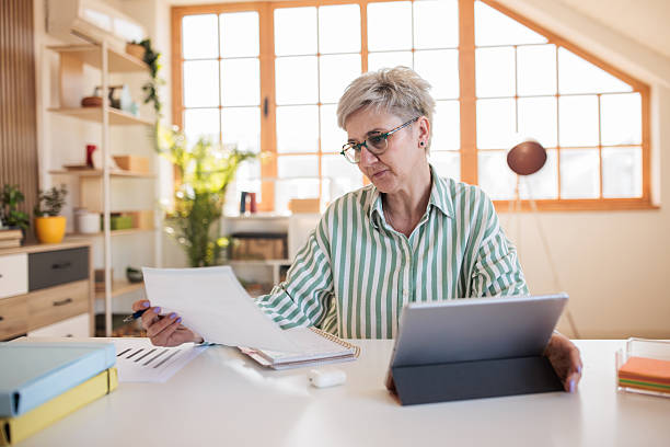 istock Woman working with a tablet at home 2207352850