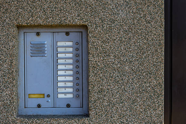 istock Combination lock control panel, intercom on the wall at the entrance to the house 2207353026