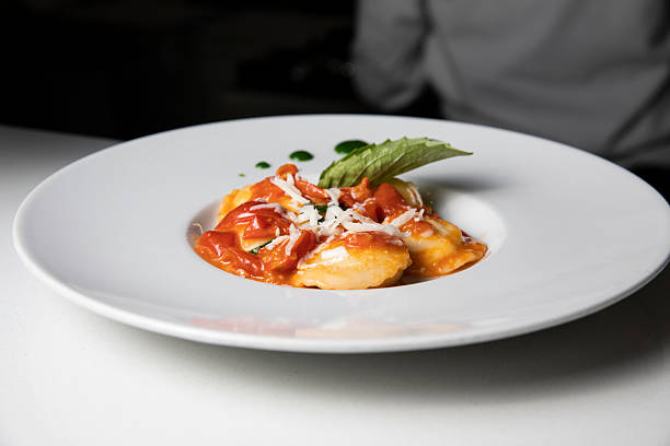 Ravioli with tomato on a plate at the restaurant