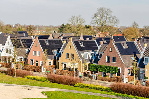 Barendrecht, The Netherlands, March 6, 2025: village-like, traditional brick houses with solar panels, in Carnisselande neighbourhood