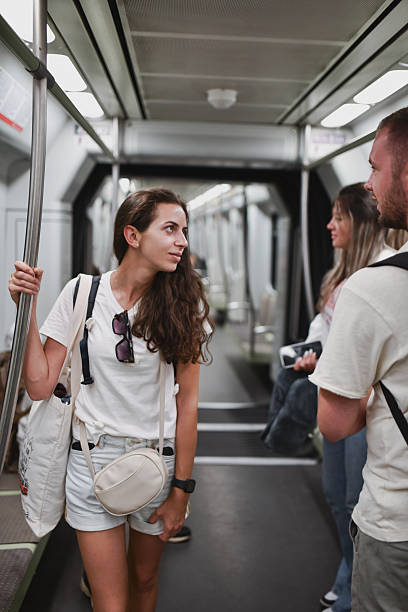 istock Excited Friends Waiting for Their Stop While Driving in Metro 2207354875