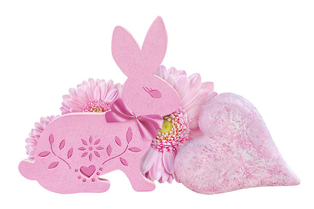 Pink Easter Bunny with heart and flowers isolated on white background