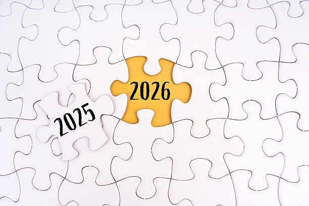 istock 2025 and 2026 written on jigsaw puzzles. New Year concept 2207358927